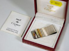 A boxed must de Cartier two tone money clip
