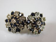 A pair of cluster earrings set with sapphire & ver