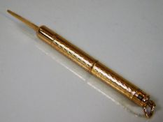 An 18ct gold French marked cigar piercer 4.6g