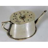 A small silver novelty pepper was watering can