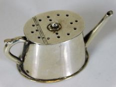 A small silver novelty pepper was watering can