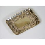 A small silver dish of good gauge with embossed de