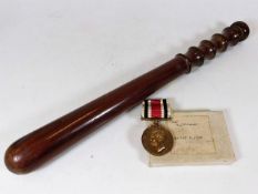 A police truncheon & police medal belonging to Spe