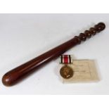 A police truncheon & police medal belonging to Spe