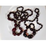 Two sets of vintage cherry amber style beads 110g