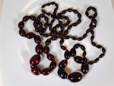 Two sets of vintage cherry amber style beads 110g
