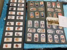 Three albums of cigarette cards