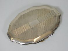 An art deco style silver compact