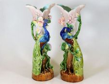 A pair of continental studio peacock spill vases