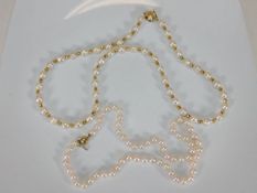 A set of pearls set with yellow metal spacers & a