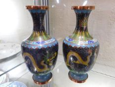A pair of Japanese Cloisonne vases, one with dent