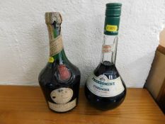 A bottle of Creme De Menthe twinned with a bottle