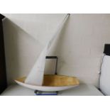 A fibreglass hull 45.5in long, a spare yacht sail