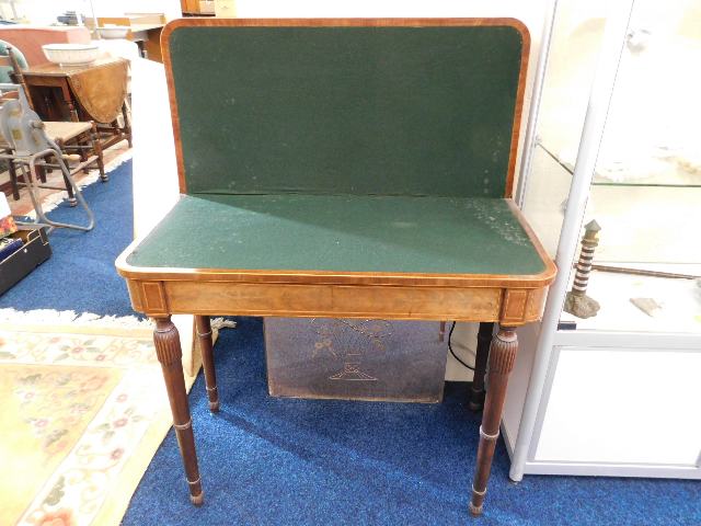 A mahogany Regency card table with satinwood inlay