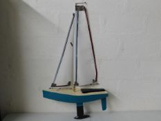 A remote control model yacht 26in long by 40in hig