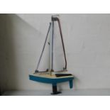 A remote control model yacht 26in long by 40in hig