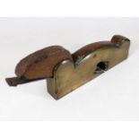 A brass footed plane