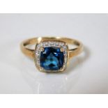 A 9ct gold ring set with blue & white stones 3.4g