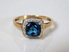 A 9ct gold ring set with blue & white stones 3.4g