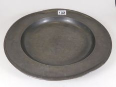 A large 19thC. pewter plate