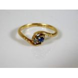 A small 18ct gold ring set with small diamond & sa