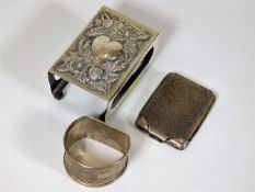 A silver vesta holder, a silver vesta case & a sil