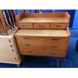 A G-Plan style teak desk with pull out & lift lid