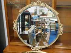 A gilt framed bevelled edge wall mirror with rope