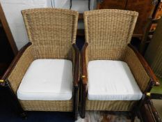 A pair of good quality wicker armchairs