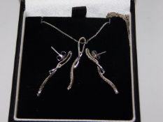 A small 9ct white gold chain, pendant & earring se