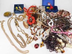 A bagged quantity of costume jewellery & plated ch