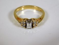 An 18ct art deco style emerald cut diamond ring 2.