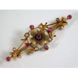An antique 15ct gold brooch set with ruby & pearl