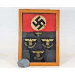 A German Third Reich Nazi framed selection of badg