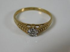 A 9ct gold ring with illusion set small diamond wi