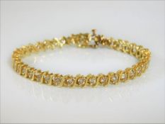 A 14ct gold & diamond line bracelet set with 4ct d