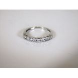 An 18ct white gold half eternity ring 2g set with