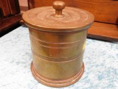 A brass shell tobacco jar