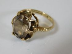 A 9ct gold smokey quartz ring