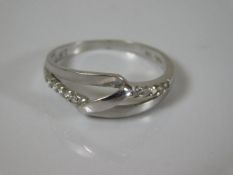 A 14ct white gold ring set with small diamonds 2.1