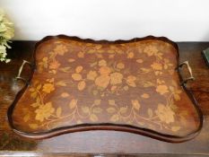 An antique inlaid tray of quatrefoil form with gallery, some damage & loss to edge