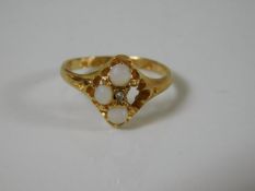 An 18ct gold ring set with opal, one missing 2.3g