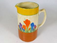 A Clarice Cliff crocus pattern jug, restored handl