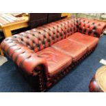 A low backed leather Chesterfield sofa, matching c