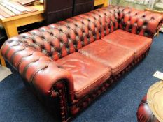 A low backed leather Chesterfield sofa, matching c