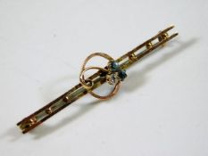A 9ct gold brooch with blue & white paste stones 1