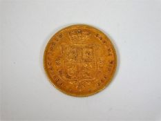 A Victorian 1884 22ct half gold sovereign