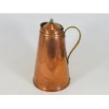 An English arts & crafts copper water carrier with Bensons Patent to brass handle