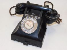 An early 20thC. bakelite telephone