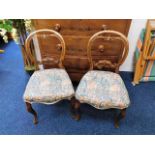 A pair of Victorian dining chairs